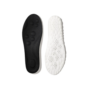 Black and white shoe insoles on a white background